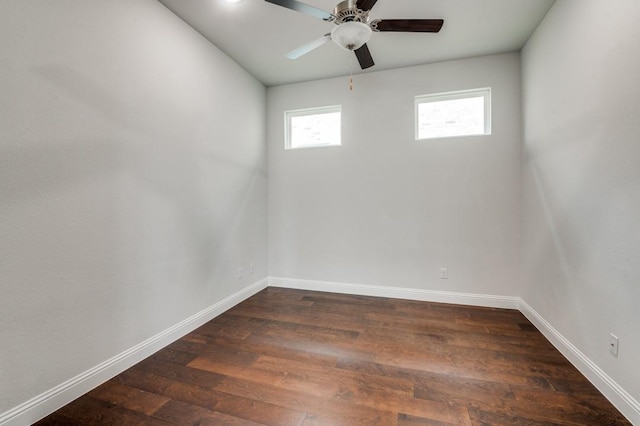 unfurnished room with dark hardwood / wood-style floors and ceiling fan