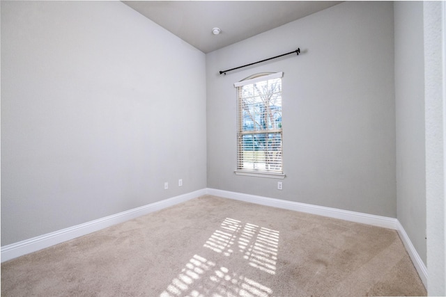 empty room with light colored carpet