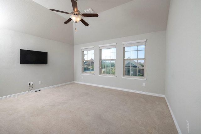 unfurnished living room with light colored carpet, high vaulted ceiling, and ceiling fan