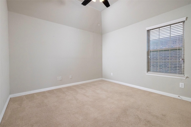 unfurnished room featuring light carpet, ceiling fan, and lofted ceiling