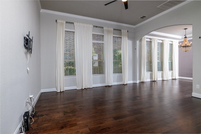 unfurnished room featuring crown molding, dark hardwood / wood-style flooring, and ceiling fan with notable chandelier