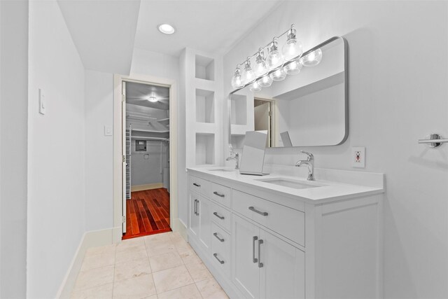 bathroom with tile patterned floors and vanity