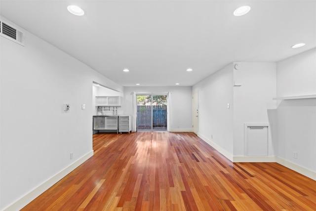 unfurnished living room featuring light wood-type flooring