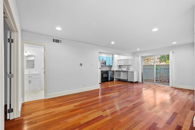 unfurnished living room featuring light wood-type flooring