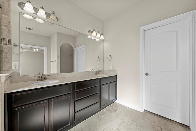 bathroom featuring tile patterned flooring, vanity, and ceiling fan