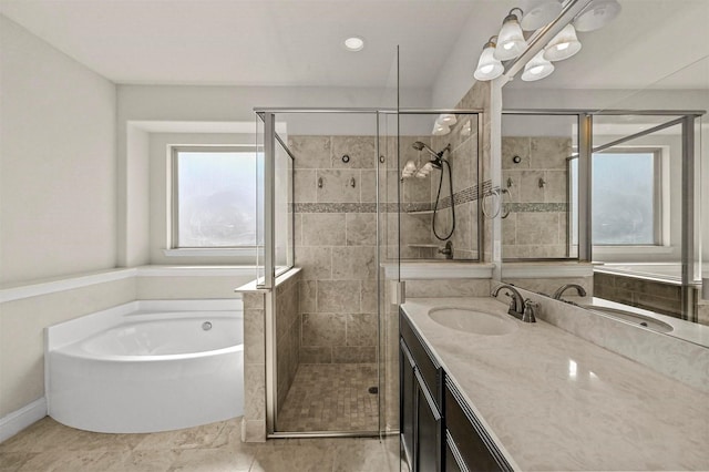 bathroom featuring vanity and separate shower and tub