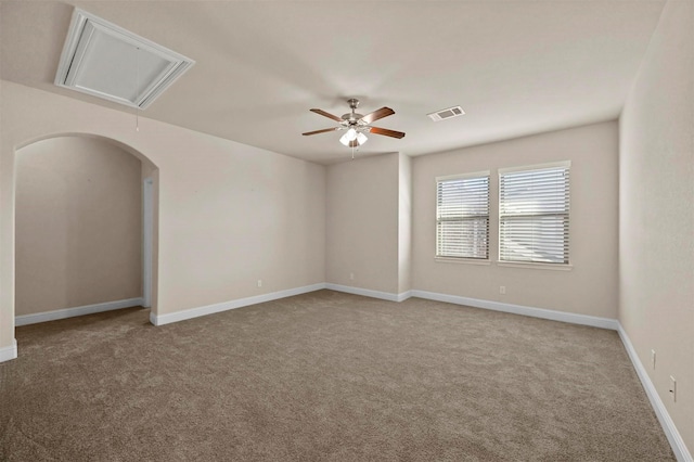 empty room with ceiling fan and light colored carpet