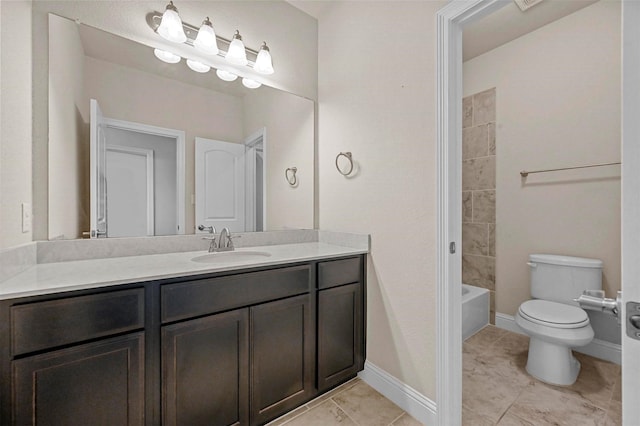 full bathroom with tile patterned flooring, vanity, tiled shower / bath combo, and toilet