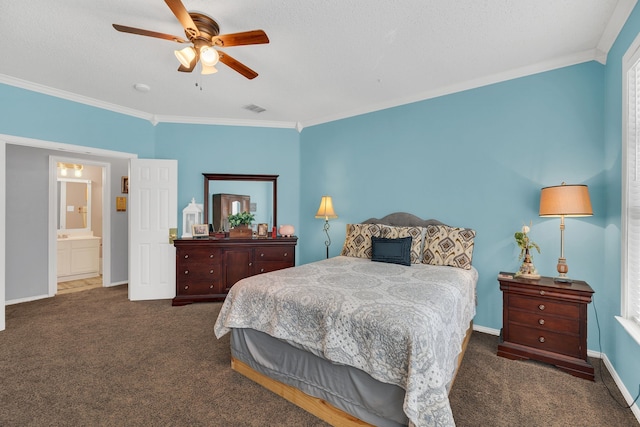 bedroom with dark colored carpet, ensuite bath, ceiling fan, and ornamental molding