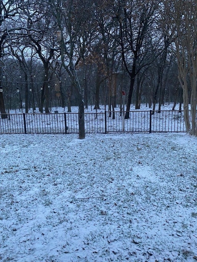 view of yard layered in snow