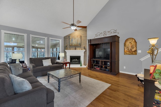 living room with ceiling fan, high vaulted ceiling, and hardwood / wood-style flooring