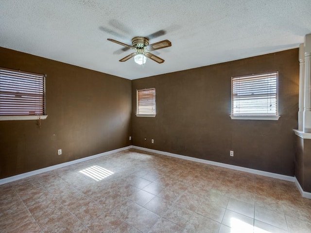 unfurnished room featuring a textured ceiling and ceiling fan