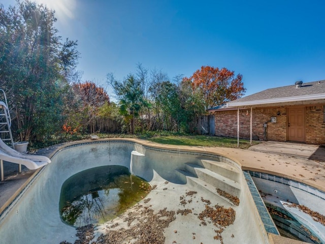 view of pool featuring a patio area and a water slide