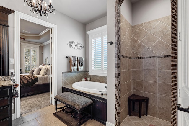 bathroom with a washtub, vanity, crown molding, and a healthy amount of sunlight