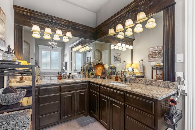 bathroom featuring vanity and a chandelier