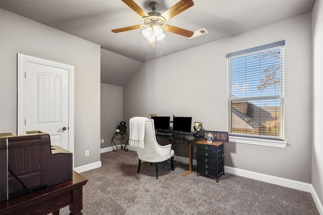 home office with ceiling fan, carpet flooring, and lofted ceiling