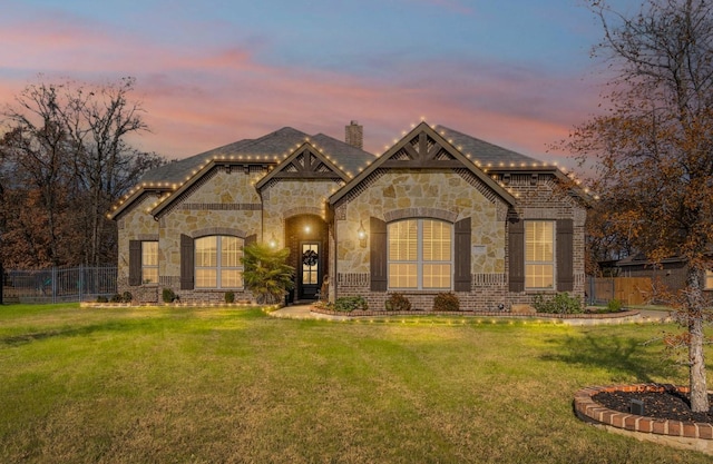 view of front of house with a yard