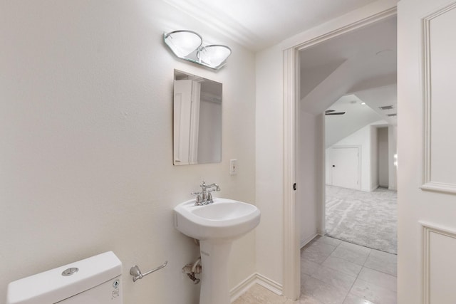 bathroom featuring tile patterned flooring and toilet