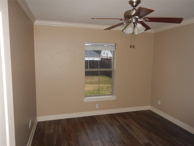 spare room with crown molding, ceiling fan, a healthy amount of sunlight, and dark hardwood / wood-style flooring