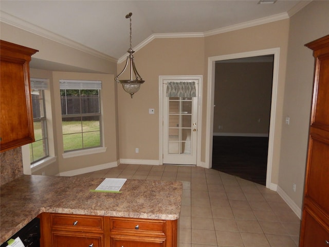 kitchen with light tile patterned flooring, lofted ceiling, hanging light fixtures, ornamental molding, and dishwasher