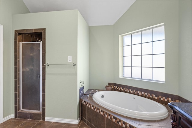 full bath with a garden tub, a shower stall, and tile patterned floors