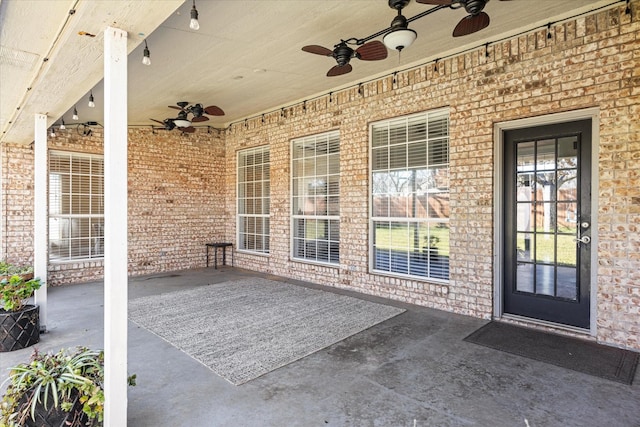 property entrance with ceiling fan