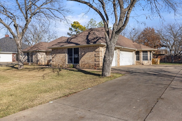 ranch-style house with a front lawn and a garage