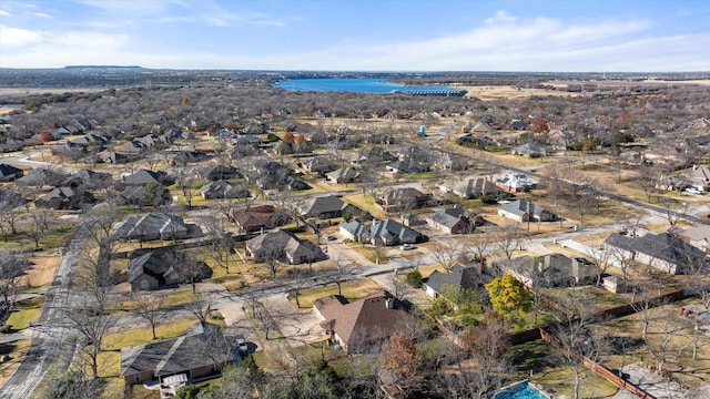 birds eye view of property with a water view and a residential view