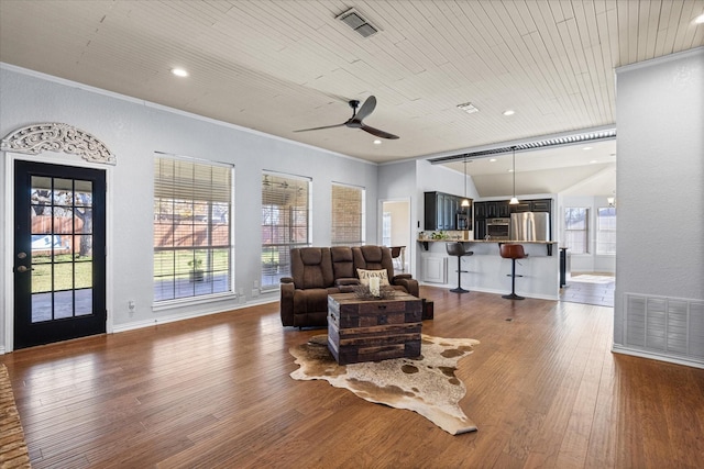 living room featuring plenty of natural light, dark hardwood / wood-style floors, wood ceiling, and ceiling fan