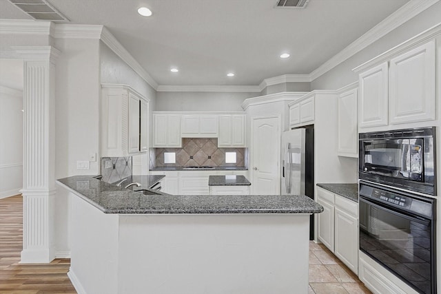 kitchen featuring black appliances, white cabinets, crown molding, light wood-type flooring, and kitchen peninsula