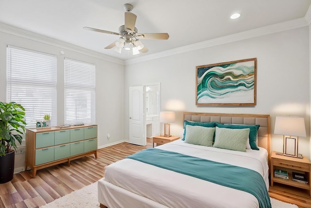 bedroom featuring ceiling fan, ornamental molding, and light wood-type flooring