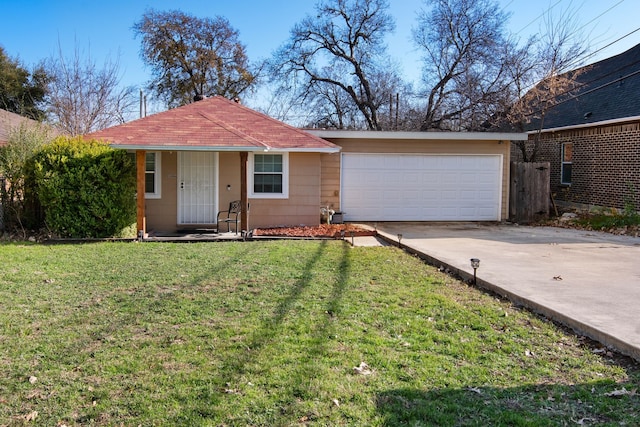 ranch-style house featuring a front yard and a garage