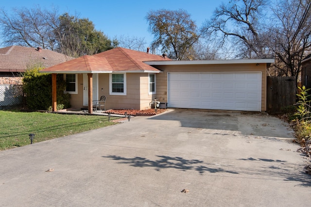 ranch-style house with a front yard and a garage