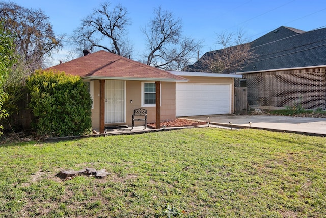 ranch-style home with a front yard and a garage