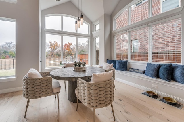 sunroom featuring vaulted ceiling