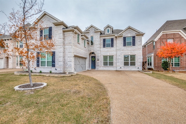 view of front of house featuring a garage and a front yard