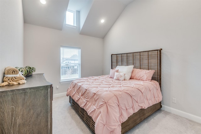 carpeted bedroom featuring multiple windows and vaulted ceiling