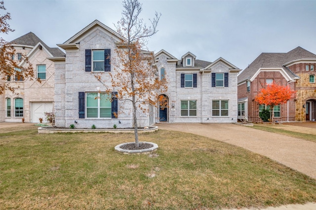 view of front of home featuring a garage and a front yard