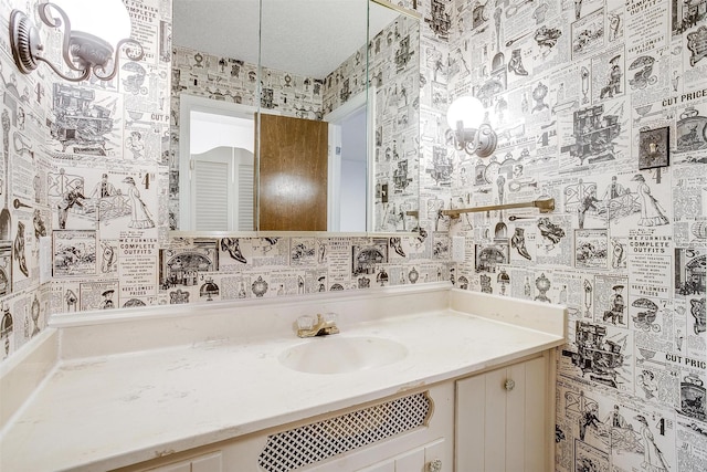 bathroom featuring vanity and a textured ceiling