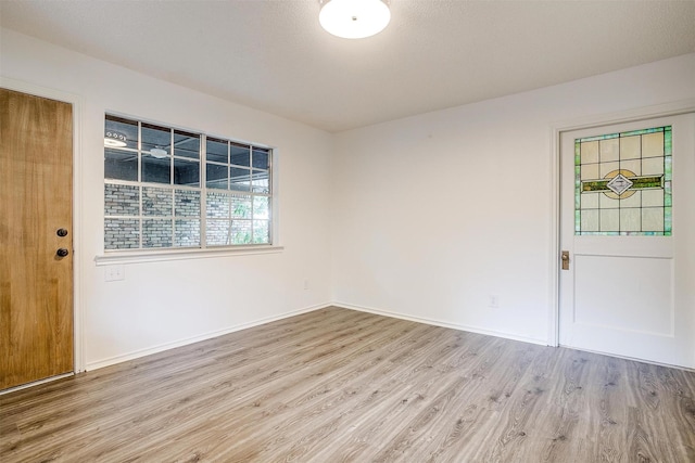 foyer entrance with light hardwood / wood-style flooring