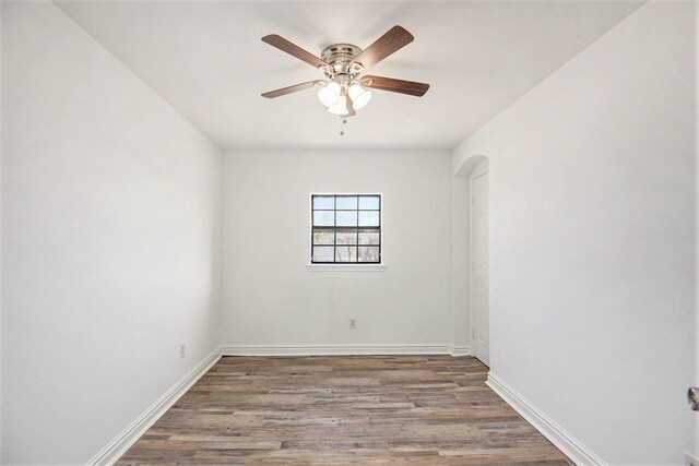 unfurnished room featuring hardwood / wood-style floors and ceiling fan