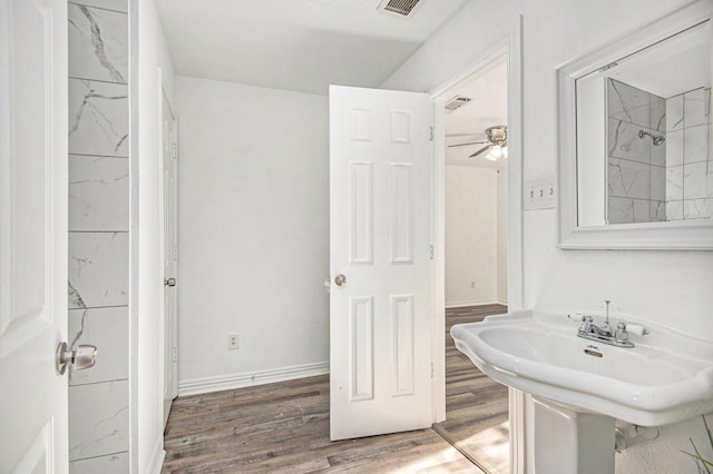 bathroom with hardwood / wood-style flooring and sink