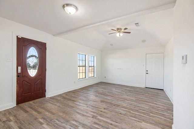 foyer with vaulted ceiling, hardwood / wood-style floors, and ceiling fan