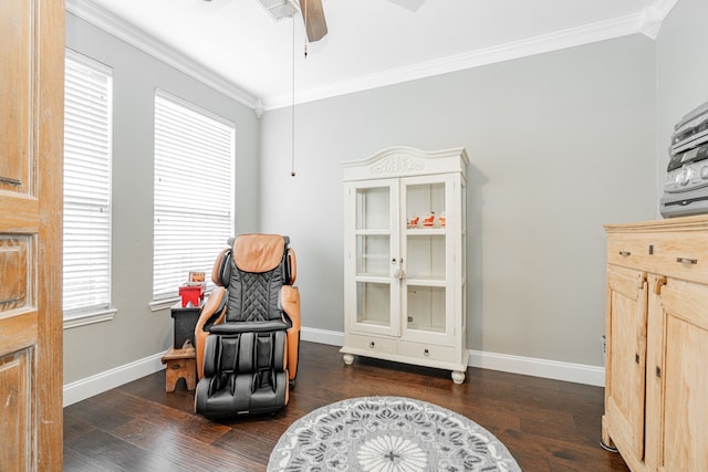 living area with crown molding, dark hardwood / wood-style flooring, and ceiling fan