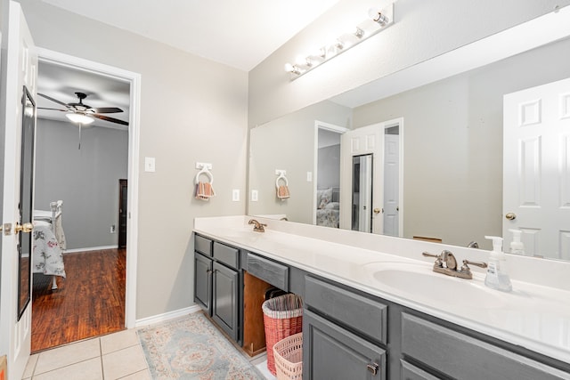 bathroom featuring tile patterned flooring, ceiling fan, and vanity