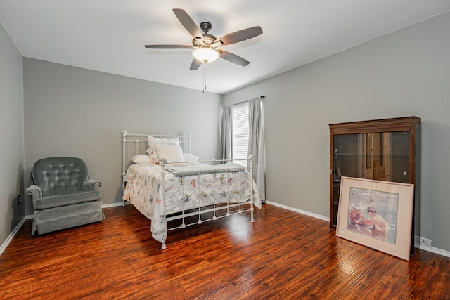 bedroom with ceiling fan and dark hardwood / wood-style floors