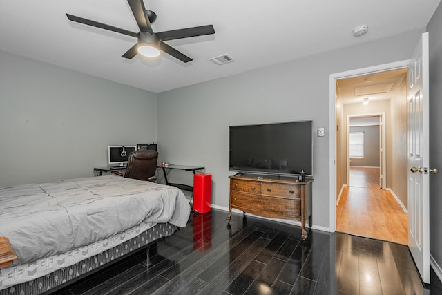 bedroom featuring ceiling fan and dark wood-type flooring