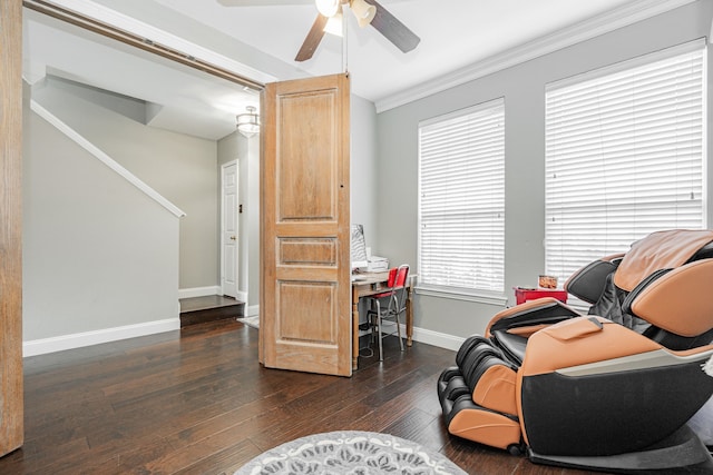 living area with dark hardwood / wood-style floors, ceiling fan, and crown molding