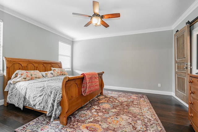 bedroom with a barn door, ceiling fan, dark hardwood / wood-style flooring, and ornamental molding