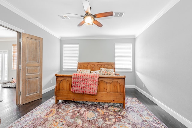 bedroom featuring crown molding, ceiling fan, and dark wood-type flooring